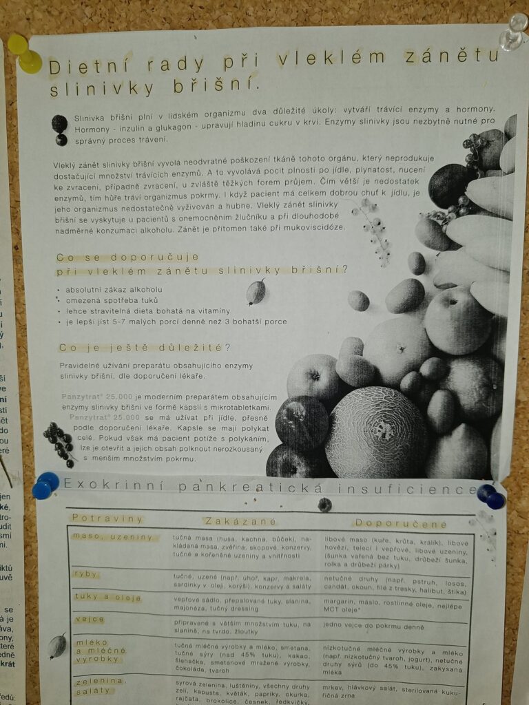 Photocopied pancreatitis diet sheet pinned to a corkboard on a Czech hospital ward, May 2023