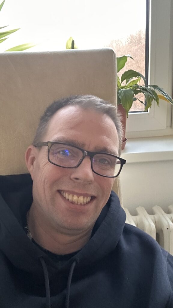 Stepan Hlucháň by a hospital window near the end of his second pancreatitis admission