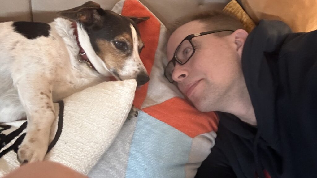 Stepan and Pasha lying face to face on the sofa